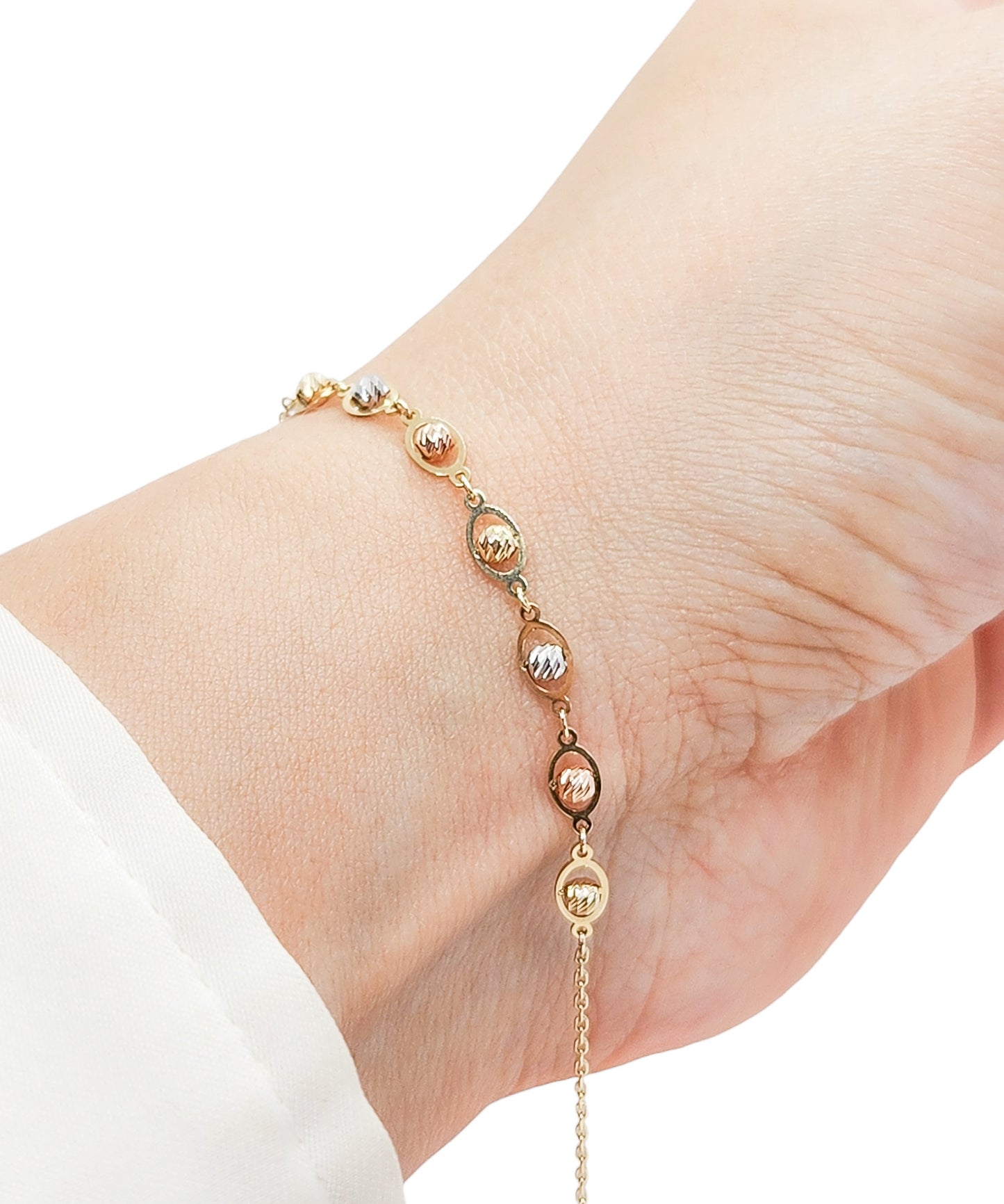 Pulsera con bolitas facetadas en 3 oros 10k