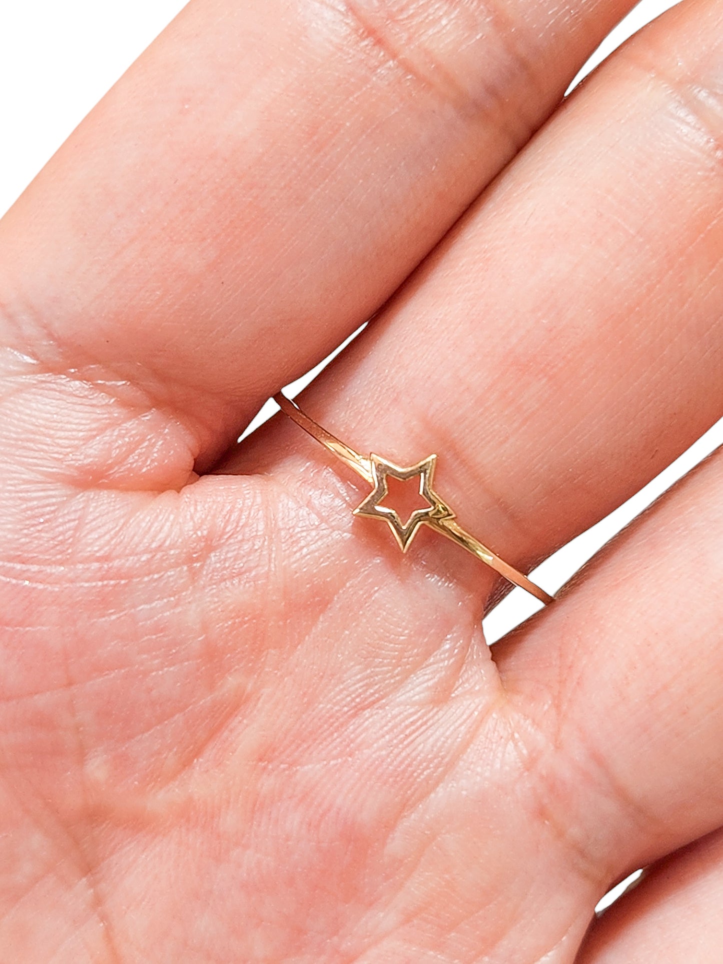 Anillo estrella contorno liso oro 10k