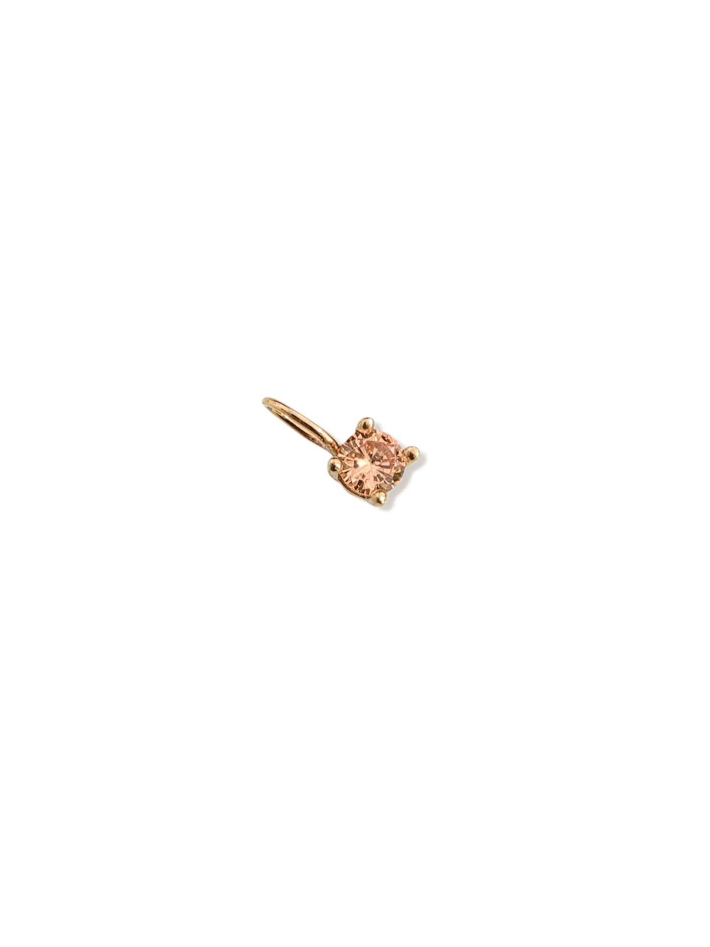 Dije redondo con zirconia champagne oro 10k
