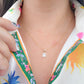 Dije corte esmeralda con zirconia blanca oro 10k