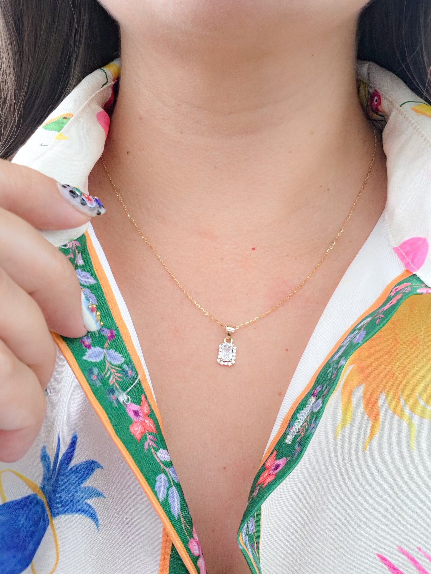 Dije corte esmeralda con zirconia blanca oro 10k