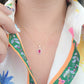 Dije corte esmeralda con zirconia rosa fiucsa oro 10k