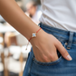 Pulsera de hilo rojo con ojito turco cruz madre perla BIMETAL