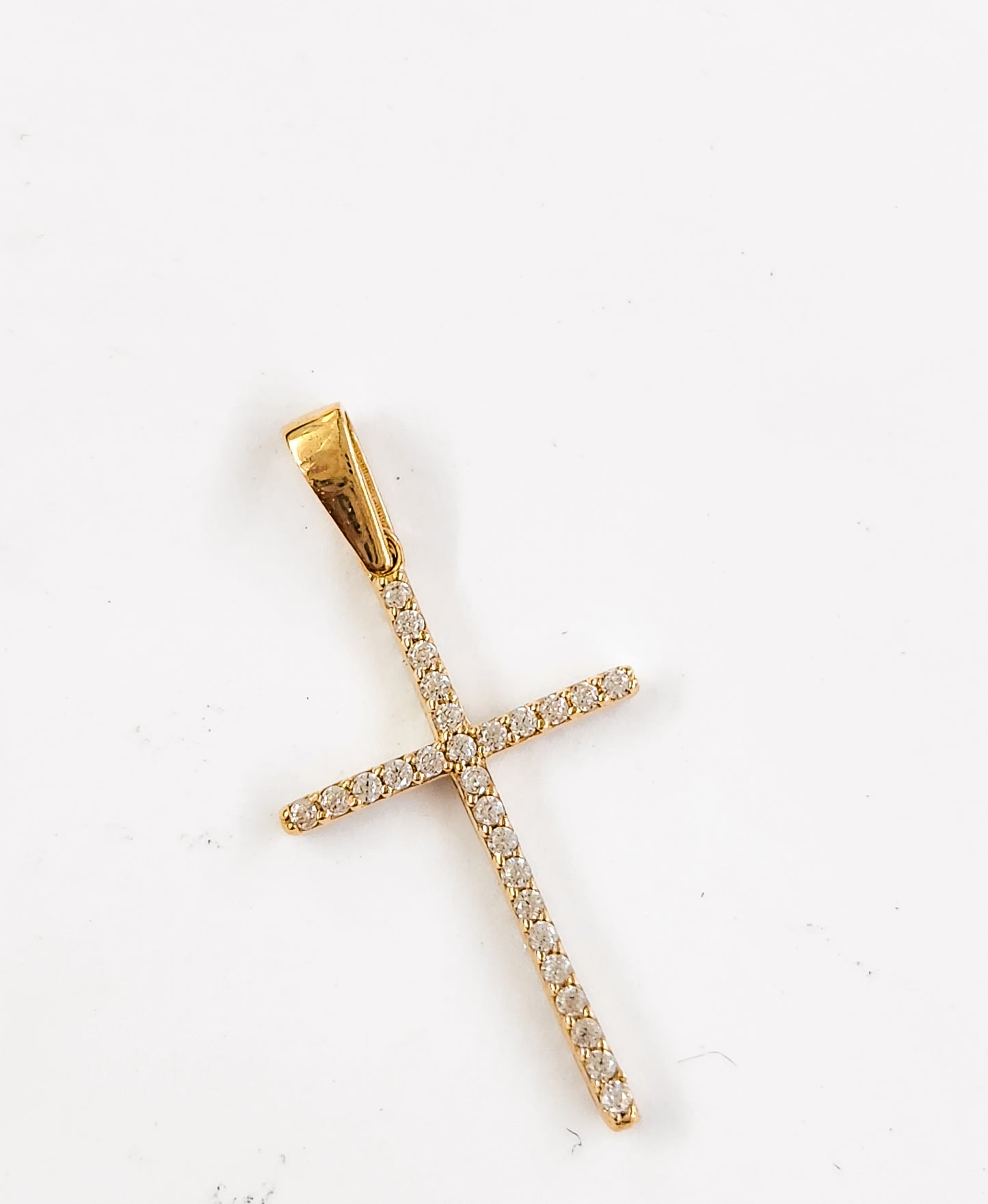 Dije cruz con piedras blancas larga oro 10k