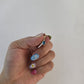 Dije corte oval con zirconia azul aqua oro 10k