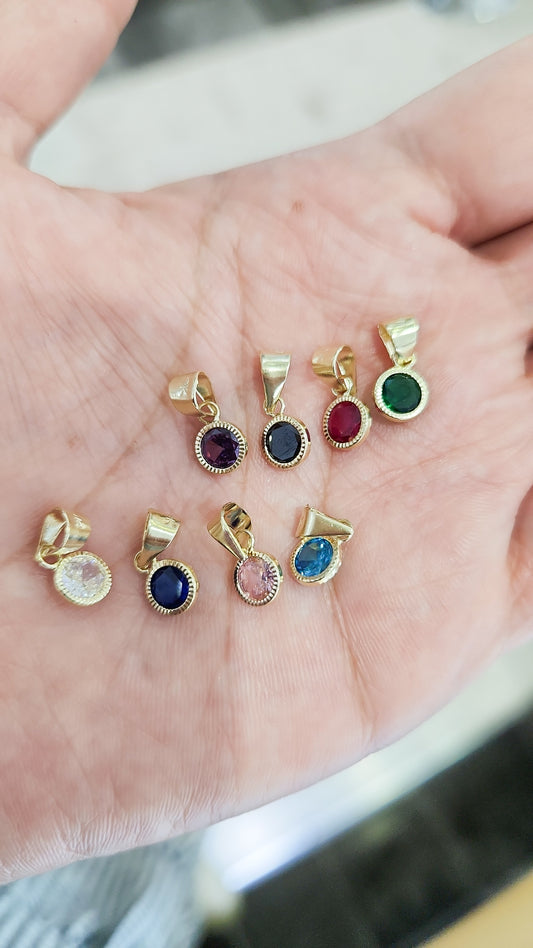 Dije redondo básico con bisel y piedra zirconia oro 10k