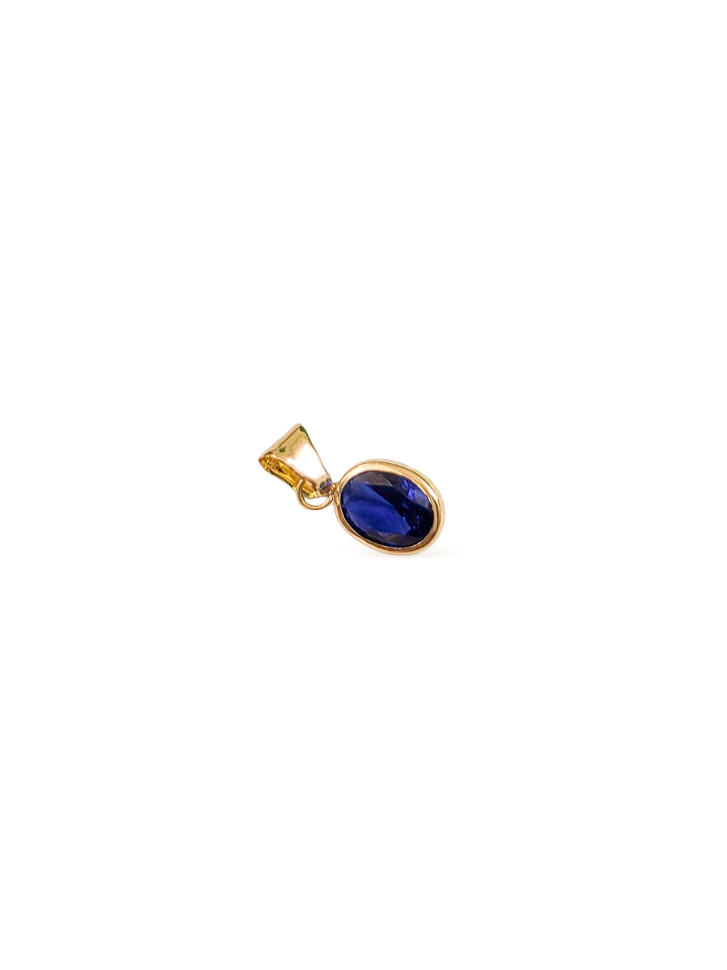 Dije corte oval con zirconia azul oro 10k