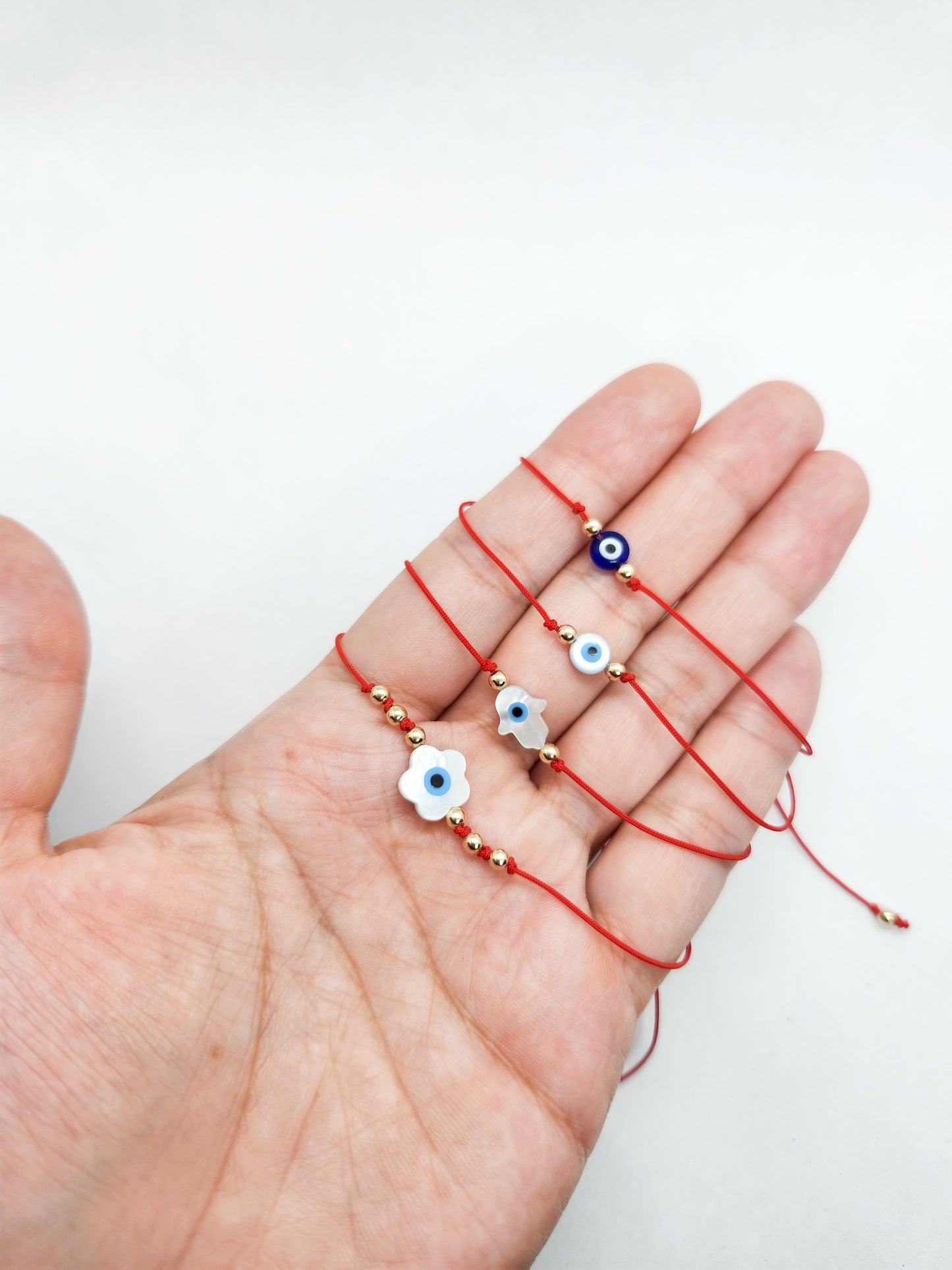 Pulsera de hilo rojo con ojito turco mano de Fatima madre perla BIMETAL
