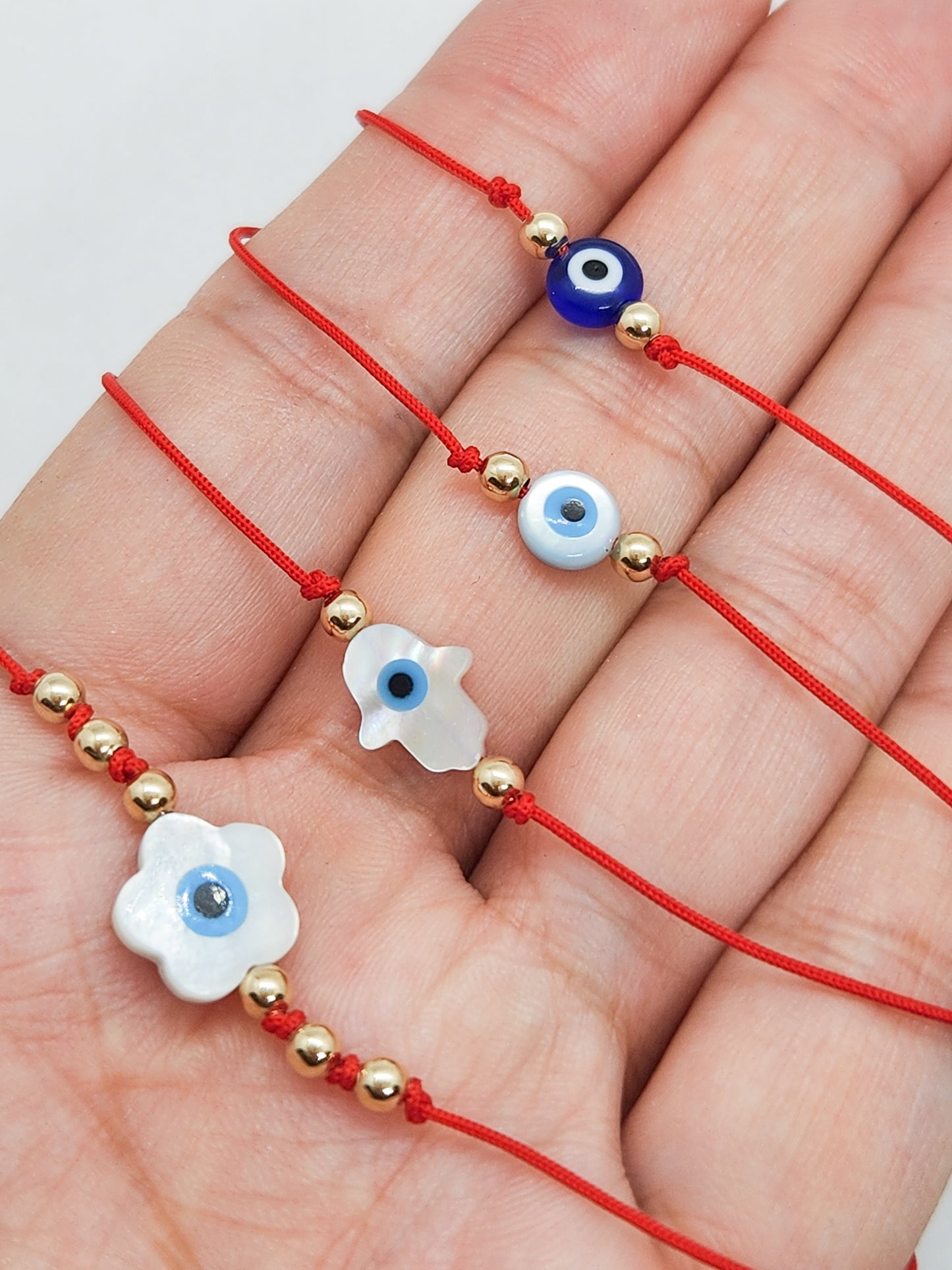 Pulsera de hilo rojo con ojito turco mano de Fatima madre perla BIMETAL